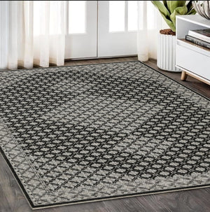 HomeRoots 5' Modern Black and Gray Diamond Area Rug with Stylish Fringe for Durable, Cozy Living Spaces 5' X 8' 574885