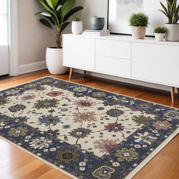 Homeroots 5' Elegant Ivory Blue Gray Floral Area Rug With Fringe - Stain Resistant, Soft Texture For Any Space 4' X 6' Polyester 574917