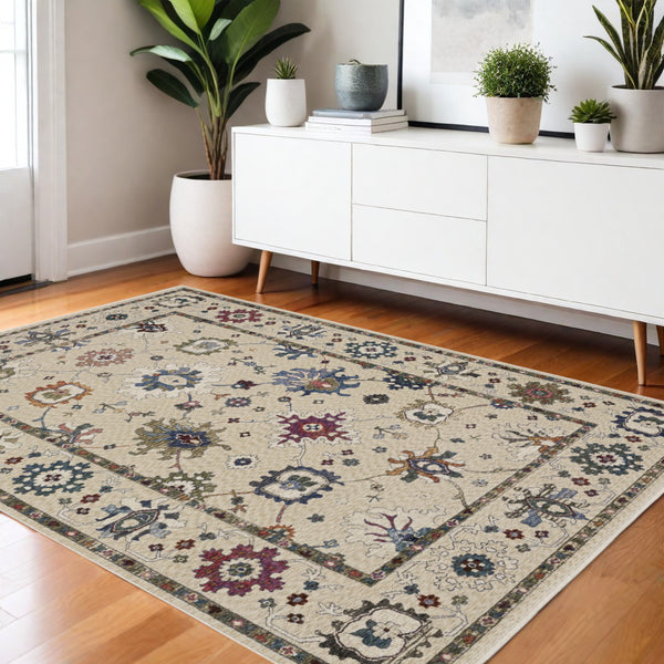 Homeroots 5' Elegant Ivory Blue Gray Floral Area Rug With Fringe - Stain Resistant, Soft Texture For Any Space 4' X 6' Polyester 574922