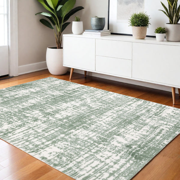 Homeroots 5' Abstract Green And Ivory Area Rug - Perfect For Kids And Pets, Stain Resistant, Artful Design 4' X 6' Polyester 575075