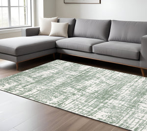 Homeroots 5' Abstract Green And Ivory Area Rug - Perfect For Kids And Pets, Stain Resistant, Artful Design 7' X 10' Polyester 575076