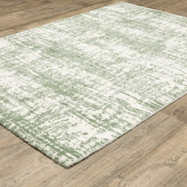 Homeroots 5' Abstract Green And Ivory Area Rug - Perfect For Kids And Pets, Stain Resistant, Artful Design 7' X 10' Polyester 575076