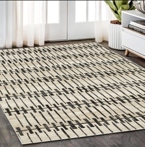 Homeroots 3' Inviting Beige And Black Geometric Area Rug – Stain Resistant, Perfect For Kids And Pets! 5' X 8' Polypropylene,Polyester 575457