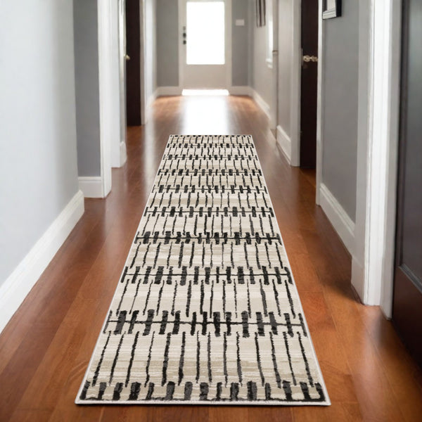 Homeroots 3' Inviting Beige And Black Geometric Area Rug – Stain Resistant, Perfect For Kids And Pets! 8' Runner Polypropylene,Polyester 575458