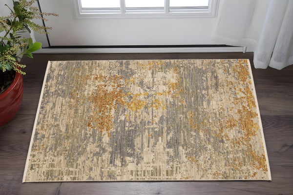 HomeRoots 3' Elevate Your Home Aesthetic with a Beige and Gold Abstract Area Rug Featuring Elegant Fringe 3' X 5' 575469