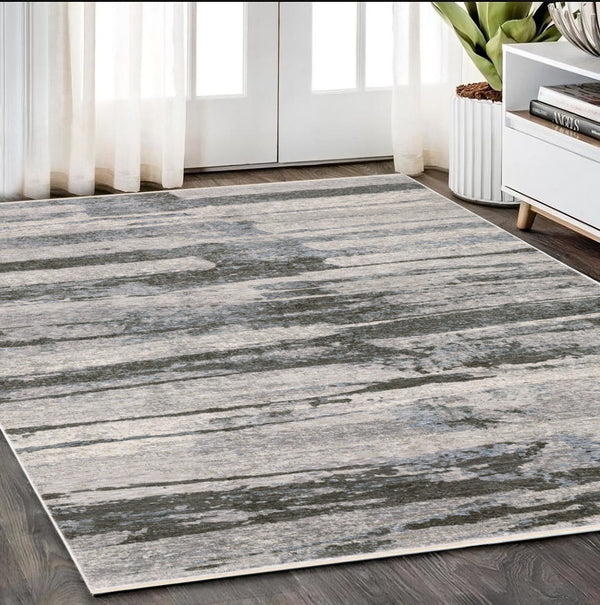 Homeroots 3' Gray Abstract Power Loom Area Rug With Fringe - Stylish, Stain-resistant Design For Any Decor 5' X 8' Polyester 575596