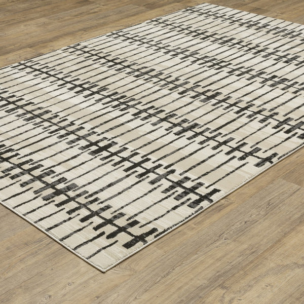 Homeroots 3' Inviting Beige And Black Geometric Area Rug – Stain Resistant, Perfect For Kids And Pets! 7' X 10' Polypropylene,Polyester 575614
