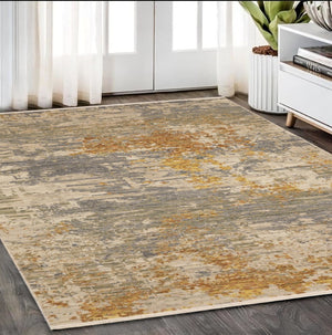 HomeRoots 3' Elevate Your Home Aesthetic with a Beige and Gold Abstract Area Rug Featuring Elegant Fringe 5' X 8' 575664
