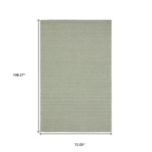 Homeroots 5' Teal Wool Hand Tufted Area Rug - Elevate Your Space With Style, Warmth, And Versatility Today! 6' X 9' Wool 575885