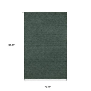 Homeroots 5' Teal Wool Hand Tufted Area Rug - Elevate Your Space With Style, Warmth, And Versatility Today! 6' X 9' Wool 575890
