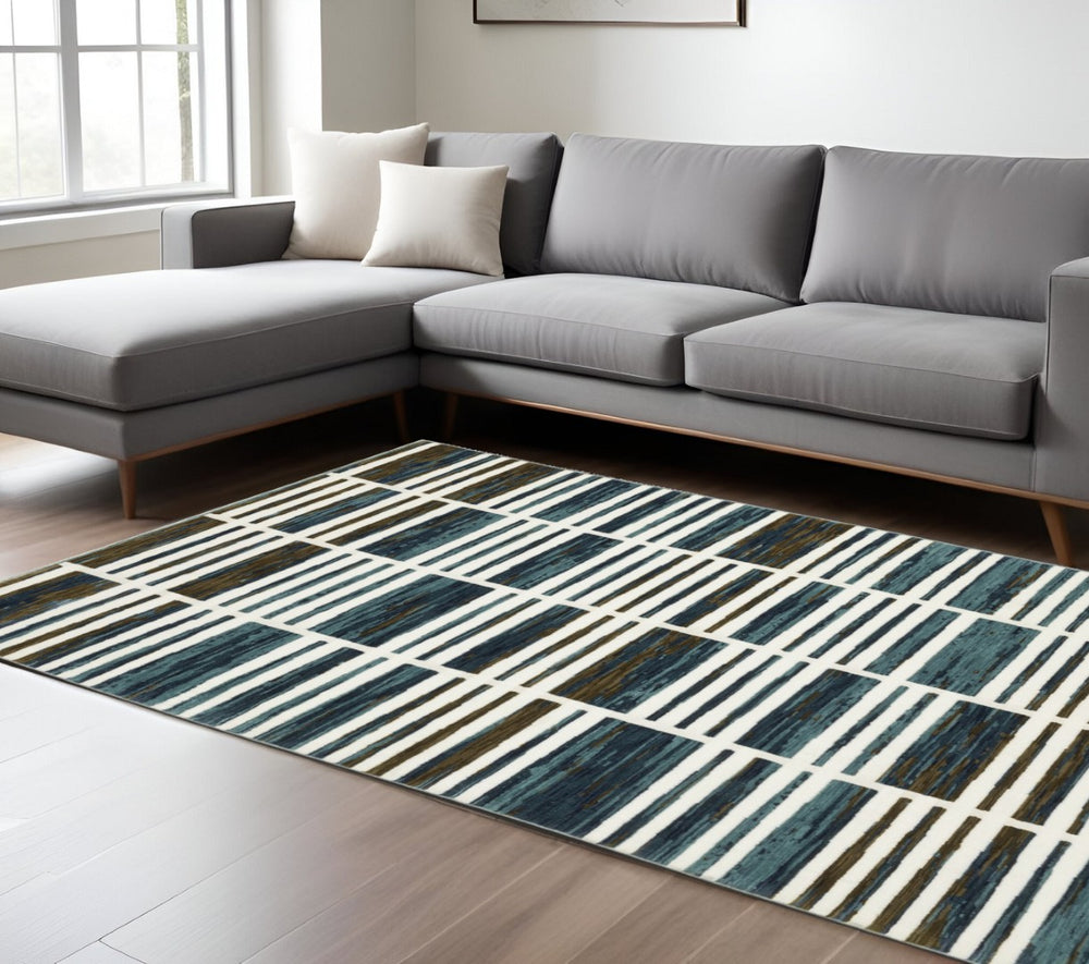 HomeRoots 3' Ivory and Blue Geometric Area Rug - Soft, Durable, and Stylish for Modern Living Spaces 8' X 11' 576095
