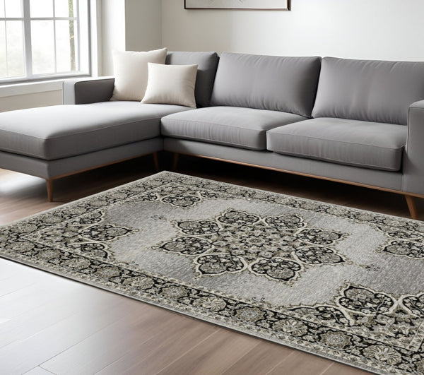 HomeRoots 3' Gray and Black Medallion Area Rug with Fringe - Timeless Design for Elegant and Cozy Spaces 8' X 11' 576464