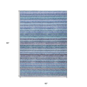 Homeroots 3' Denim Blue And Gray Striped Washable Area Rug For Indoor And Outdoor Use – Durable & Stylish! 5' X 8' Polyester 577806