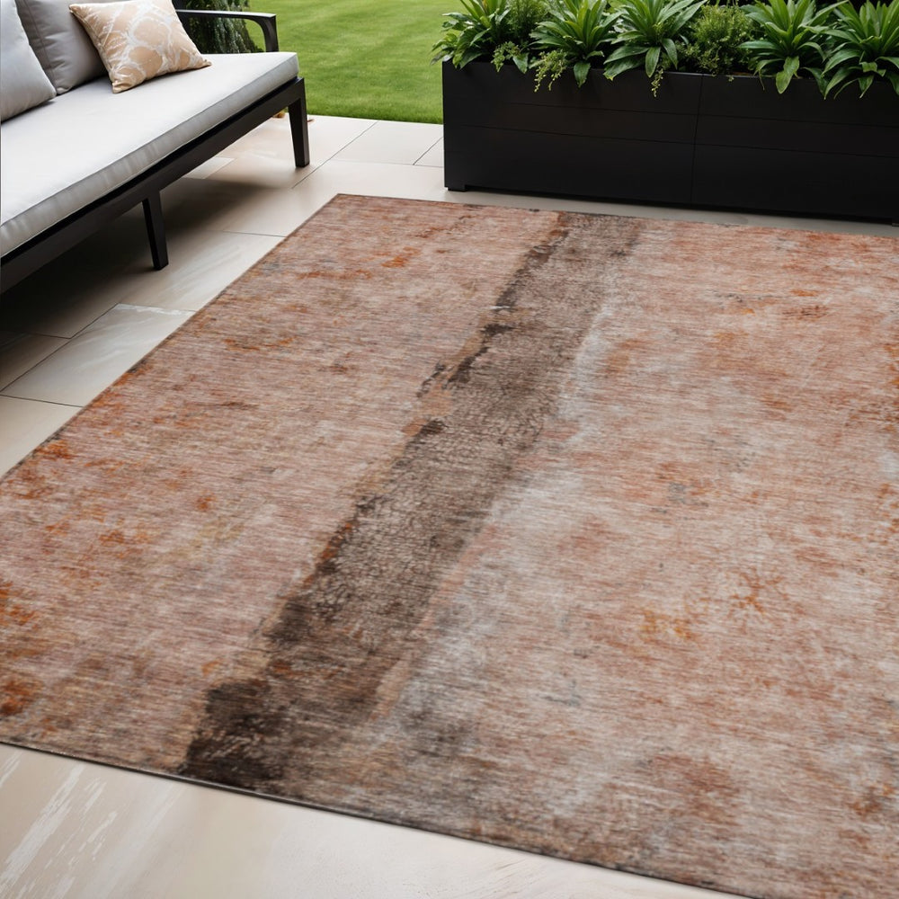 HomeRoots 5' Abstract Indoor Outdoor Area Rug in Vibrant Orange, Peach, and Brown - Durable, Washable, Stylish 5' X 8' 578041