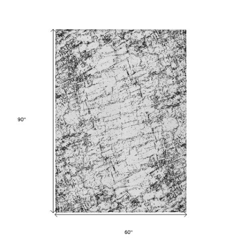 Homeroots 3' Stylish Black, White & Gray Abstract Washable Area Rug For Indoor & Outdoor Spaces 5' X 8' Polyester 578065