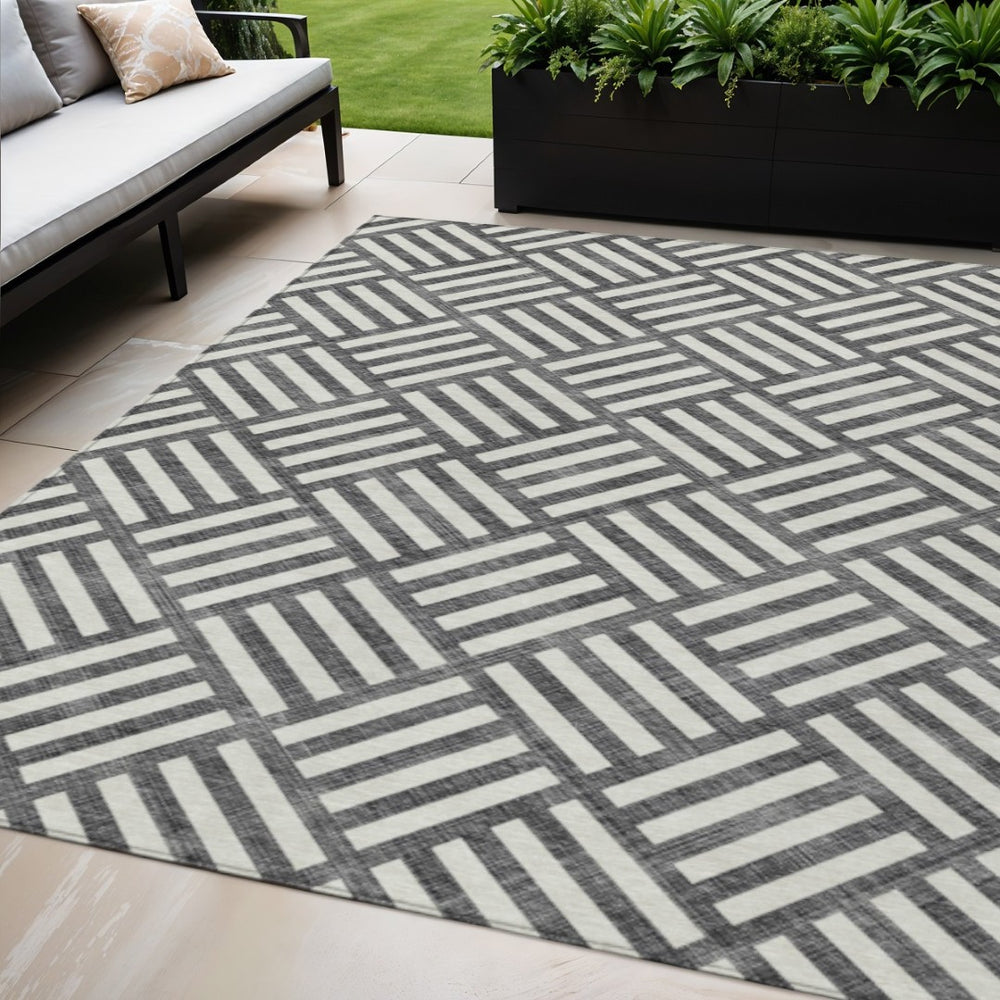 HomeRoots 5' Black and Ivory Geometric Area Rug - Modern, Durable, Washable for Indoor and Outdoor Spaces 5' X 8' 578713