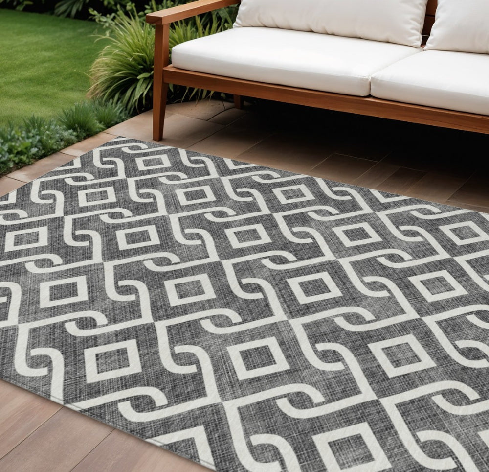 HomeRoots 9' Modern Black and Ivory Geometric Washable Area Rug for Indoor and Outdoor Durability and Style 9' X 12' 578854