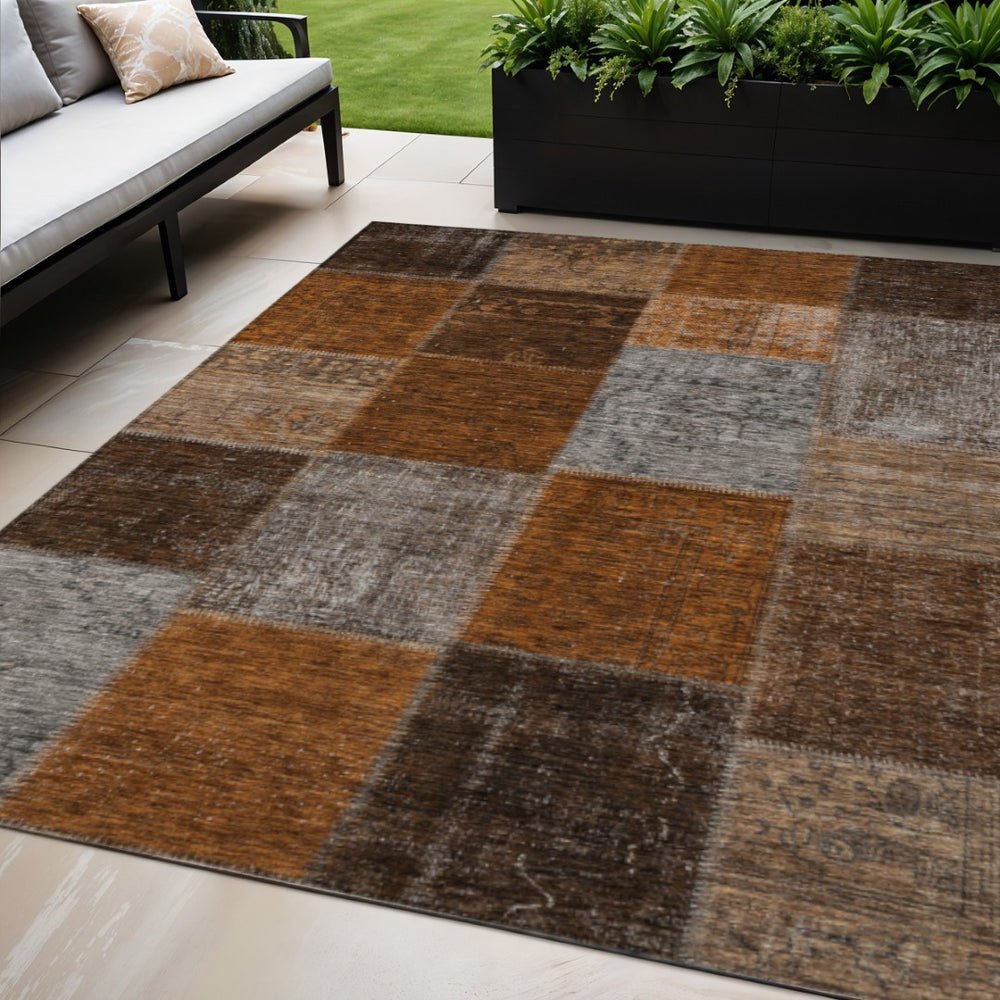 HomeRoots 5' Bold Orange and Taupe Patchwork Indoor Outdoor Area Rug - Durable, Washable, and Stylish Design 5' X 8' 580659