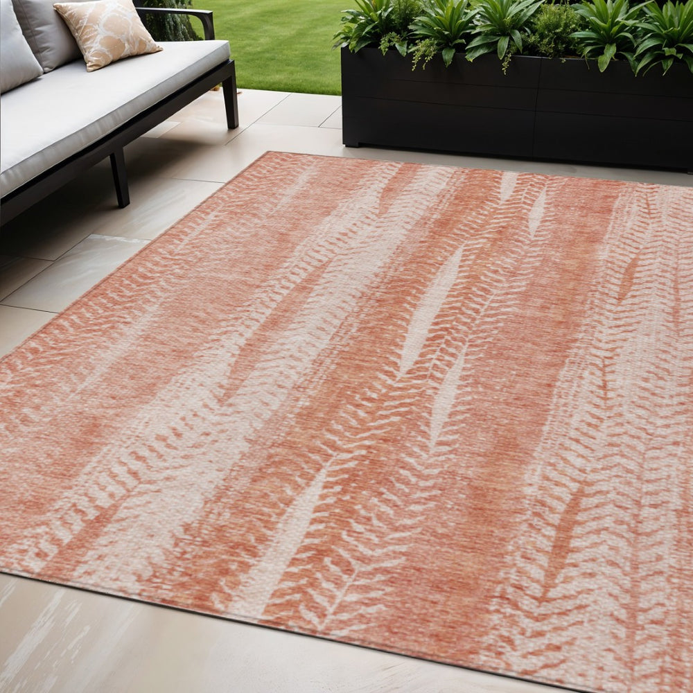 HomeRoots 5' Vibrant Orange and Salmon Botanical Leaves Washable Area Rug for Indoor and Outdoor Spaces 5' X 8' 581973