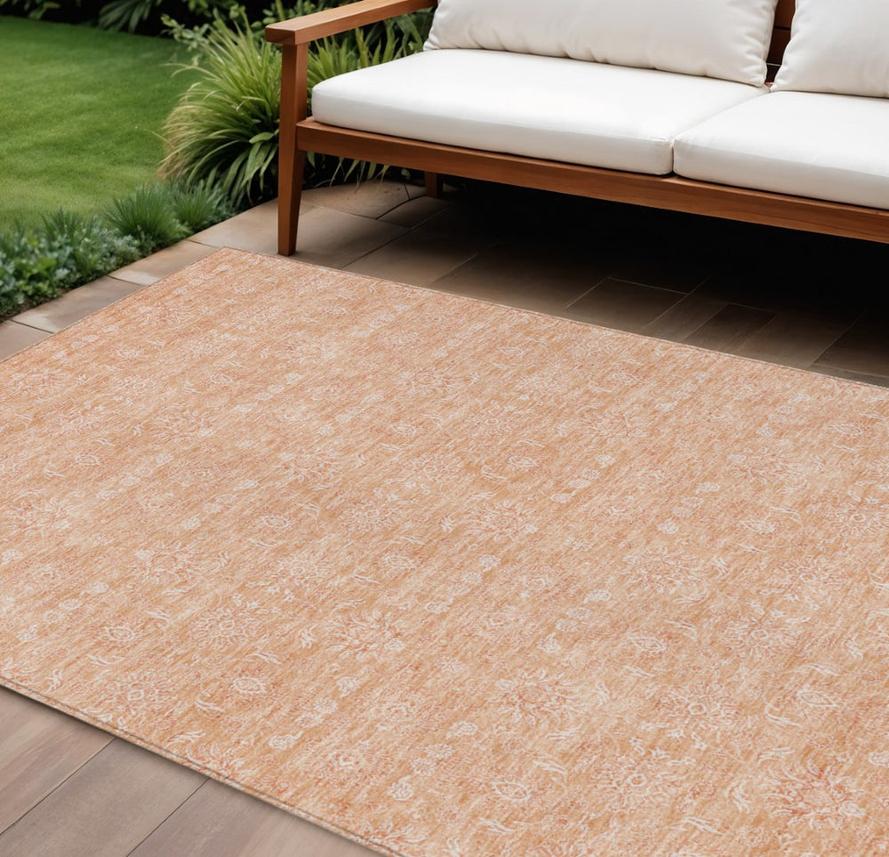 HomeRoots 5' Peach and Ivory Floral Area Rug - Stylish, Washable Design for Indoor and Outdoor Spaces 10' X 14' 582367