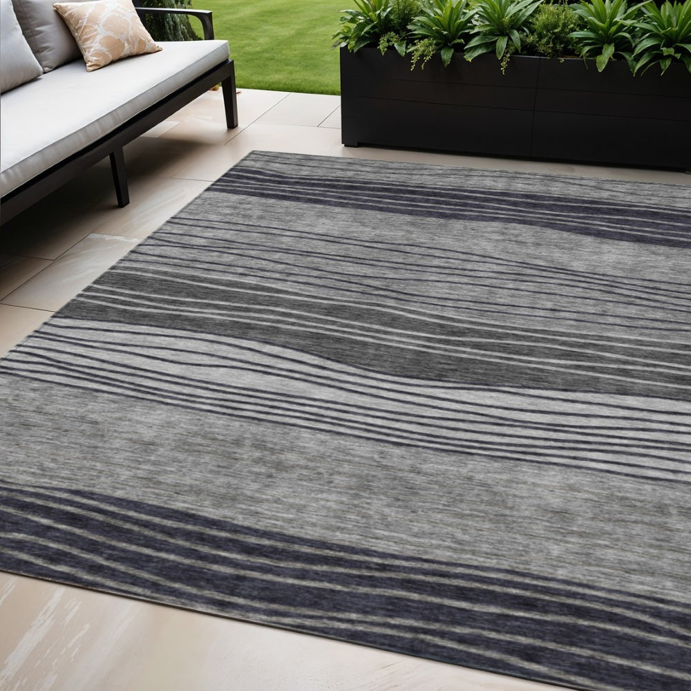 HomeRoots 5' Stylish Gray Charcoal and Silver Striped Washable Area Rug for Indoor and Outdoor Spaces 5' X 8' 583871