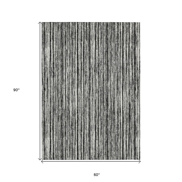 HomeRoots 5' Black and Ivory Striped Area Rug - Durable, Washable Design for Indoor and Outdoor Spaces 5' X 8' 585467