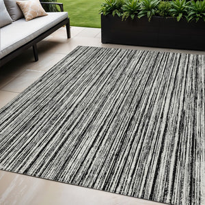 HomeRoots 5' Black and Ivory Striped Area Rug - Durable, Washable Design for Indoor and Outdoor Spaces 5' X 8' 585467
