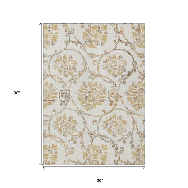 HomeRoots 5' Elegant Ivory and Gold Floral Area Rug - Durable, Washable Design for Indoor and Outdoor Use 5' X 8' 585641