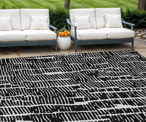 HomeRoots 5' Durable Black and Ivory Abstract Area Rug – Stylish, Washable Design for Indoor and Outdoor Use 8' X 10' 588495