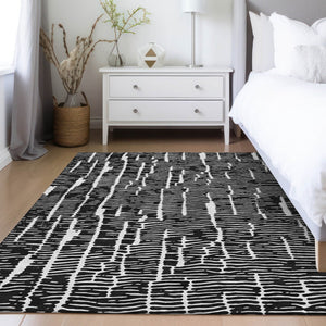HomeRoots 5' Durable Black and Ivory Abstract Area Rug – Stylish, Washable Design for Indoor and Outdoor Use 10' X 14' 588497