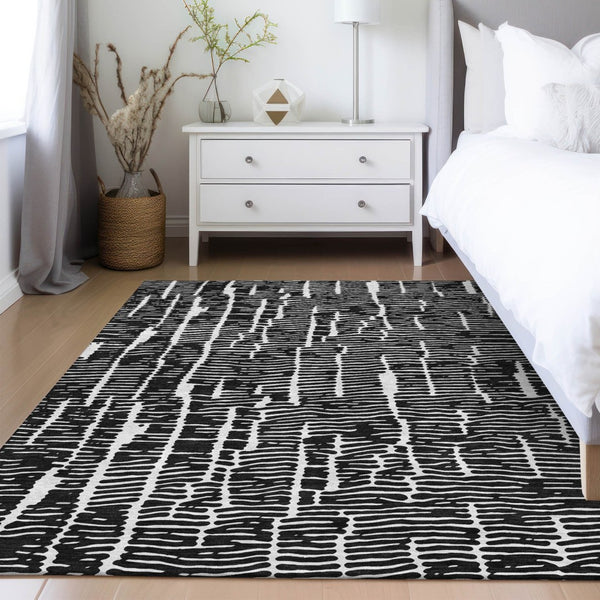 HomeRoots 5' Durable Black and Ivory Abstract Area Rug – Stylish, Washable Design for Indoor and Outdoor Use 10' X 14' 588497