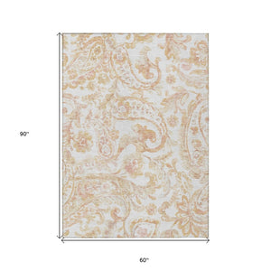 HomeRoots 5' Coral Ivory Peach Paisley Area Rug - Stylish, Durable, Washable for Indoor & Outdoor Spaces 5' X 8' 588643