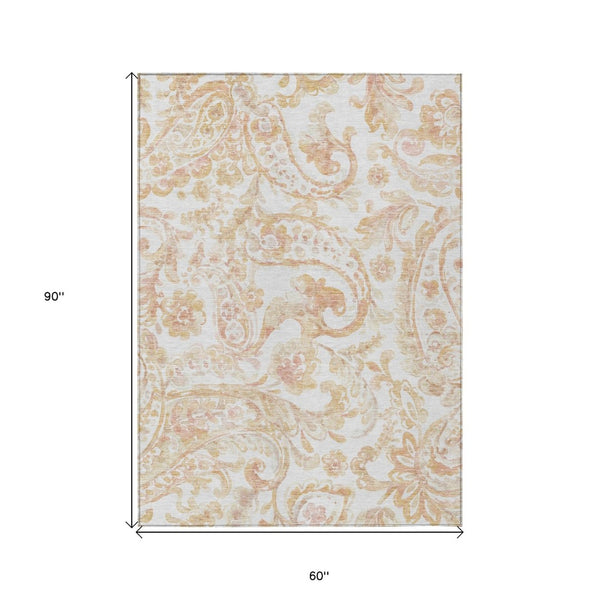 HomeRoots 5' Coral Ivory Peach Paisley Area Rug - Stylish, Durable, Washable for Indoor & Outdoor Spaces 5' X 8' 588643