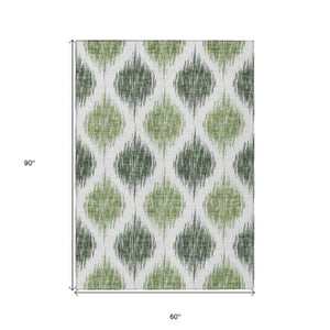 Homeroots 3' Stylish Artichoke Green Ivory Gray Ikat Washable Area Rug For Indoor Outdoor Spaces, Durable Design 5' X 8' Polyester 589093