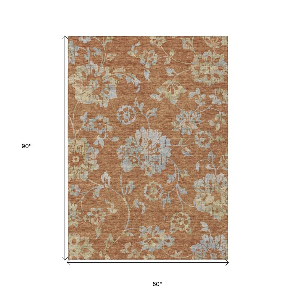 HomeRoots 5' Vibrant Orange Copper and Gray Floral Washable Area Rug for Stylish Indoor and Outdoor Spaces 5' X 8' 589495