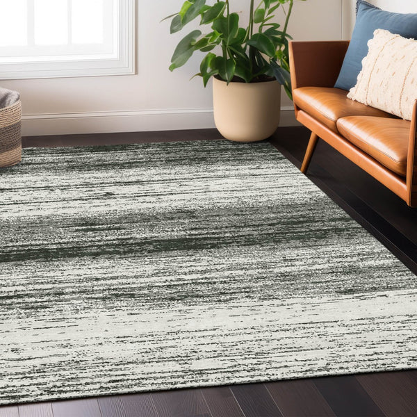 Homeroots 3' Black Ivory And Gray Striped Indoor Outdoor Area Rug - Stylish, Washable, And Stain Resistant! 3' X 5' Polyester 589656