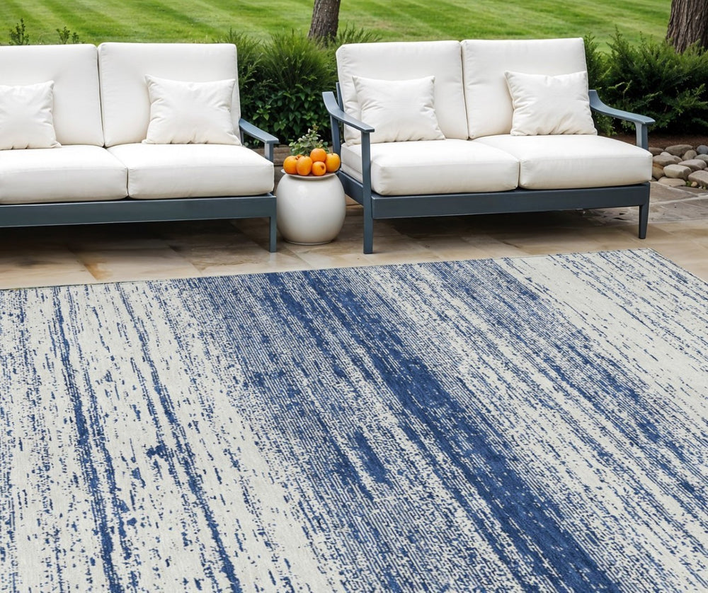 HomeRoots 9' Navy Blue and Ivory Striped Indoor Outdoor Area Rug - Durable, Washable, Coastal Charm for Any Space 9' X 12' 589708