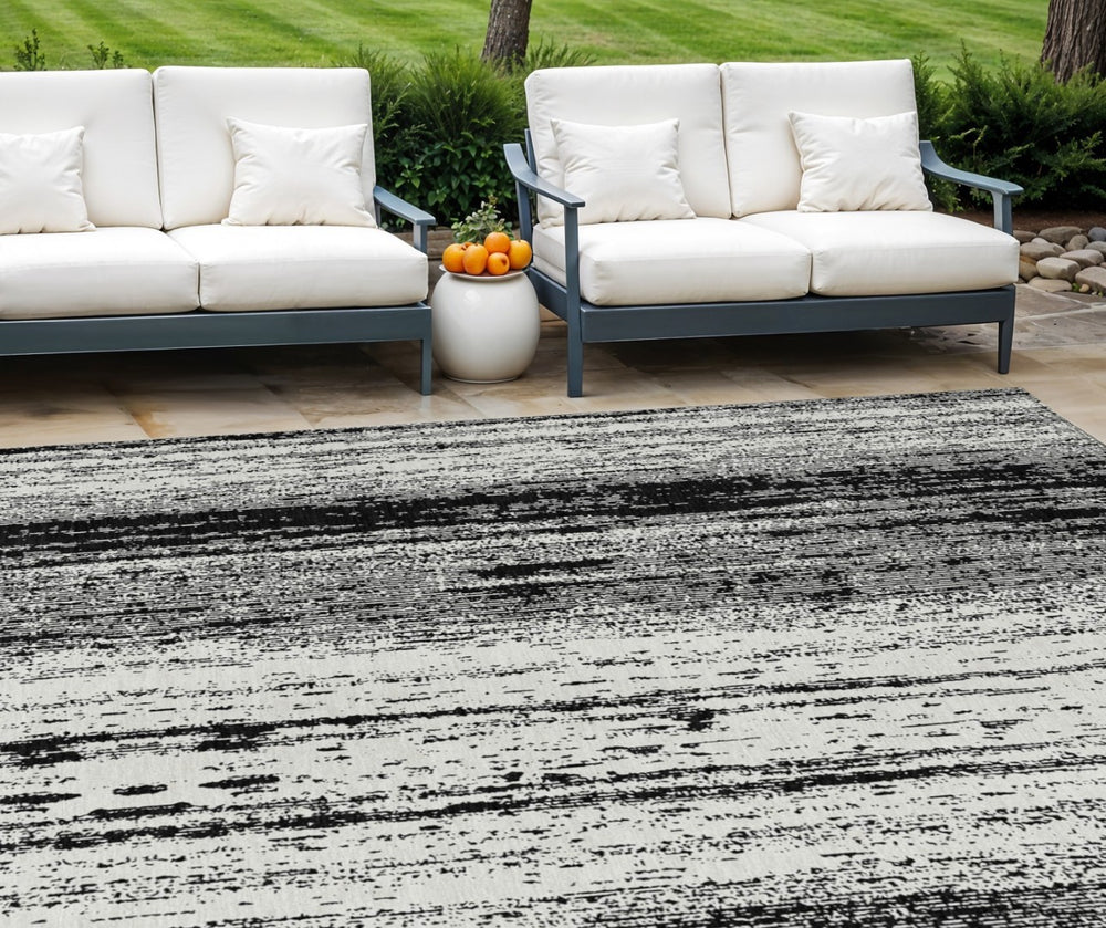 HomeRoots 5' Black and Ivory Striped Washable Area Rug - Stylish, Durable Design for Indoor and Outdoor Spaces 10' X 14' 589859
