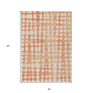 HomeRoots 5' Coral and Ivory Abstract Area Rug – Durable, Washable Design for Indoor and Outdoor Spaces 5' X 8' 590938