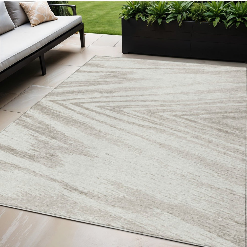HomeRoots 5' Ivory and Beige Abstract Area Rug - Durable, Washable Design for Indoor and Outdoor Spaces 5' X 8' 591538
