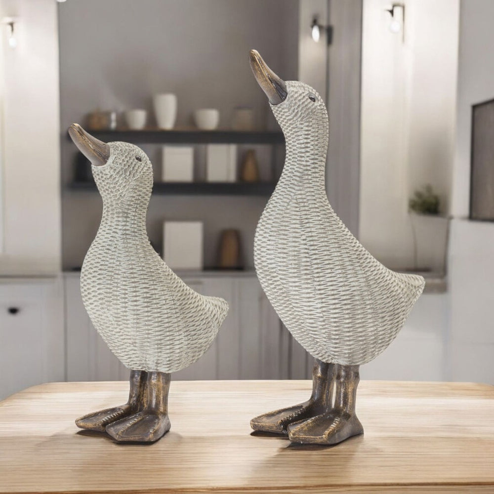 HomeRoots Set of Four Brown Resin Figurines - Modern Tabletop Sculptures for Home Decor & Thoughtful Gifts 592958