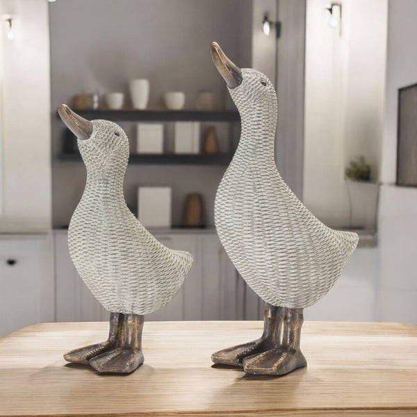 HomeRoots Set of Four Brown Resin Figurines - Modern Tabletop Sculptures for Home Decor & Thoughtful Gifts 592958