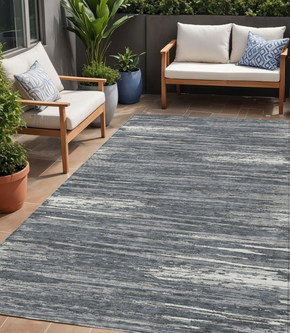 HomeRoots 5' Stylish Gray and Ivory Striped Washable Area Rug for Indoor and Outdoor Spaces, Durable & Versatile 5' X 8' 593277