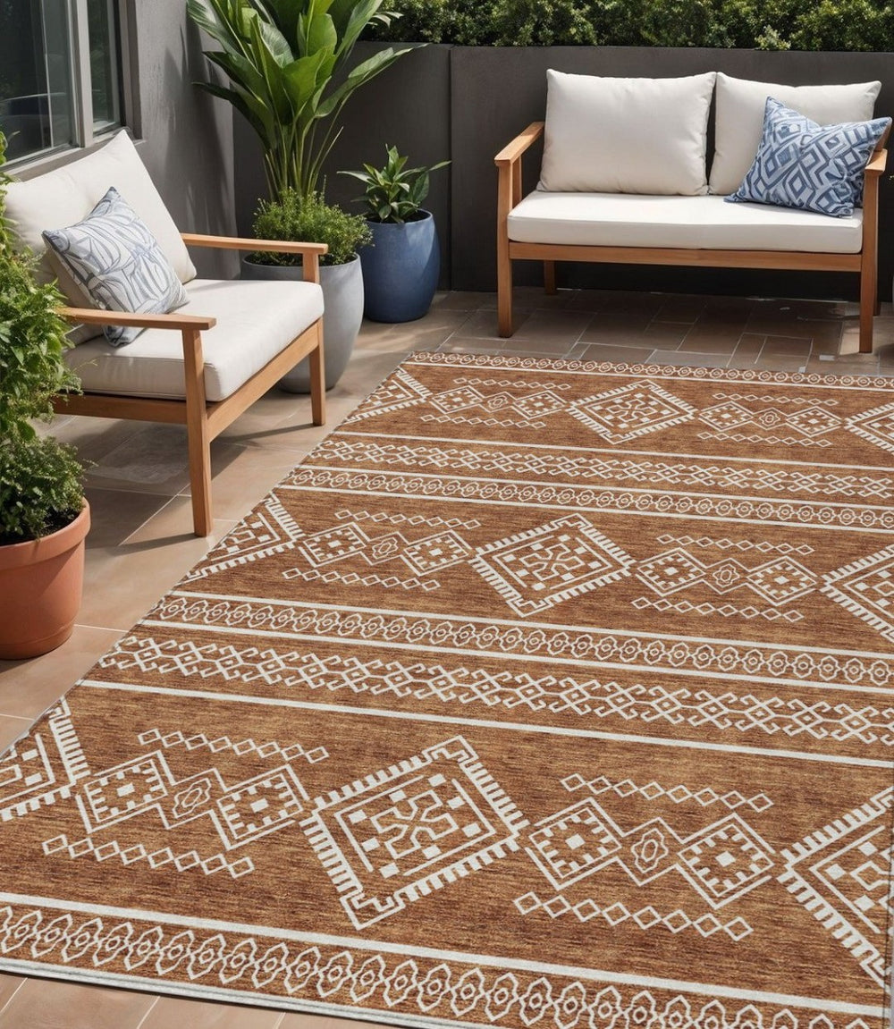 HomeRoots 5' Southwestern Area Rug in Vibrant Orange and Ivory - Washable for Indoor and Outdoor Use 5' X 8' 593709