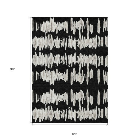 Homeroots 3' Stylish Black Ivory And Gray Striped Washable Area Rug For Indoor And Outdoor Versatility 5' X 8' Polyester 593999