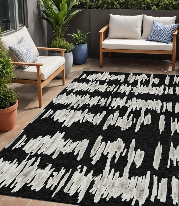 Homeroots 3' Stylish Black Ivory And Gray Striped Washable Area Rug For Indoor And Outdoor Versatility 5' X 8' Polyester 593999