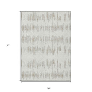 Homeroots 3' Stylish Black Ivory And Gray Striped Washable Area Rug For Indoor And Outdoor Versatility 3' X 5' Polyester 594028