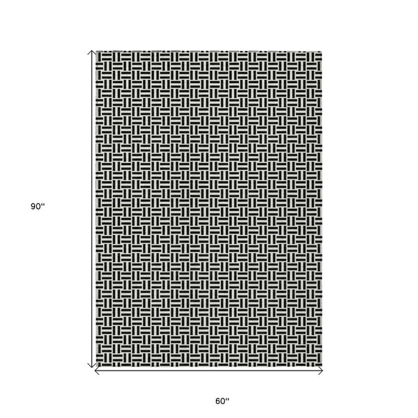 HomeRoots 5' Black And Ivory Geometric Area Rug - Versatile Indoor Outdoor Mat for Easy Care and Style 5' X 8' 594444