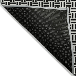 HomeRoots 5' Black And Ivory Geometric Area Rug - Versatile Indoor Outdoor Mat for Easy Care and Style 5' X 8' 594444