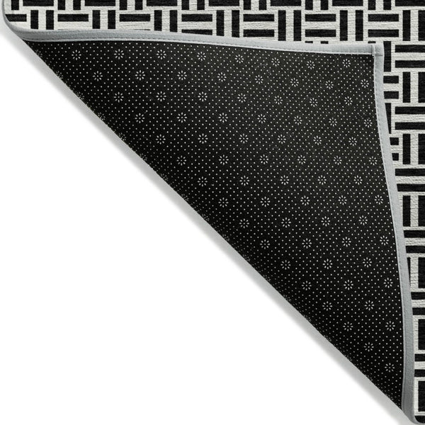 HomeRoots 5' Black And Ivory Geometric Area Rug - Versatile Indoor Outdoor Mat for Easy Care and Style 5' X 8' 594444